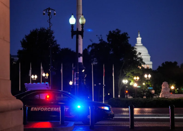 A law enforcement vehicle stands in front of Union Station near the US Capitol in Washington, DC, on Monday. Ken Cedeno/Reuters
