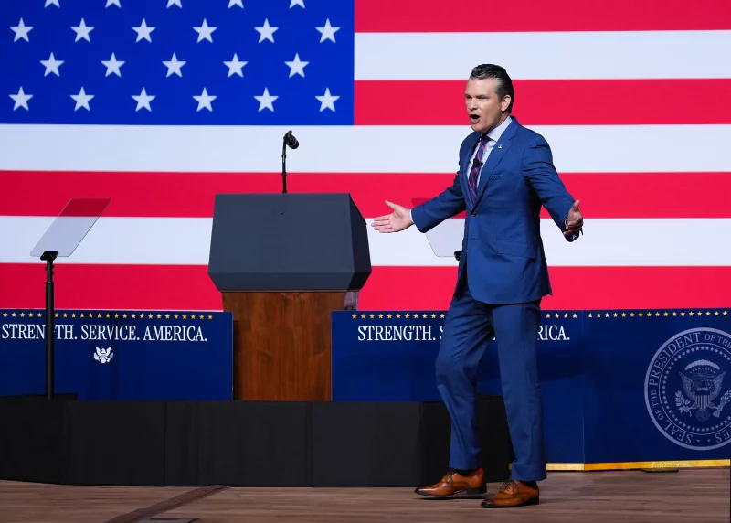 Defense Secretary Pete Hegseth speaks to senior military leaders at Marine Corps Base Quantico on Tuesday in Quantico, Va. In an unprecedented gathering, almost 800 generals, admirals and their senior enlisted leaders were ordered into one location from around the world on short notice.